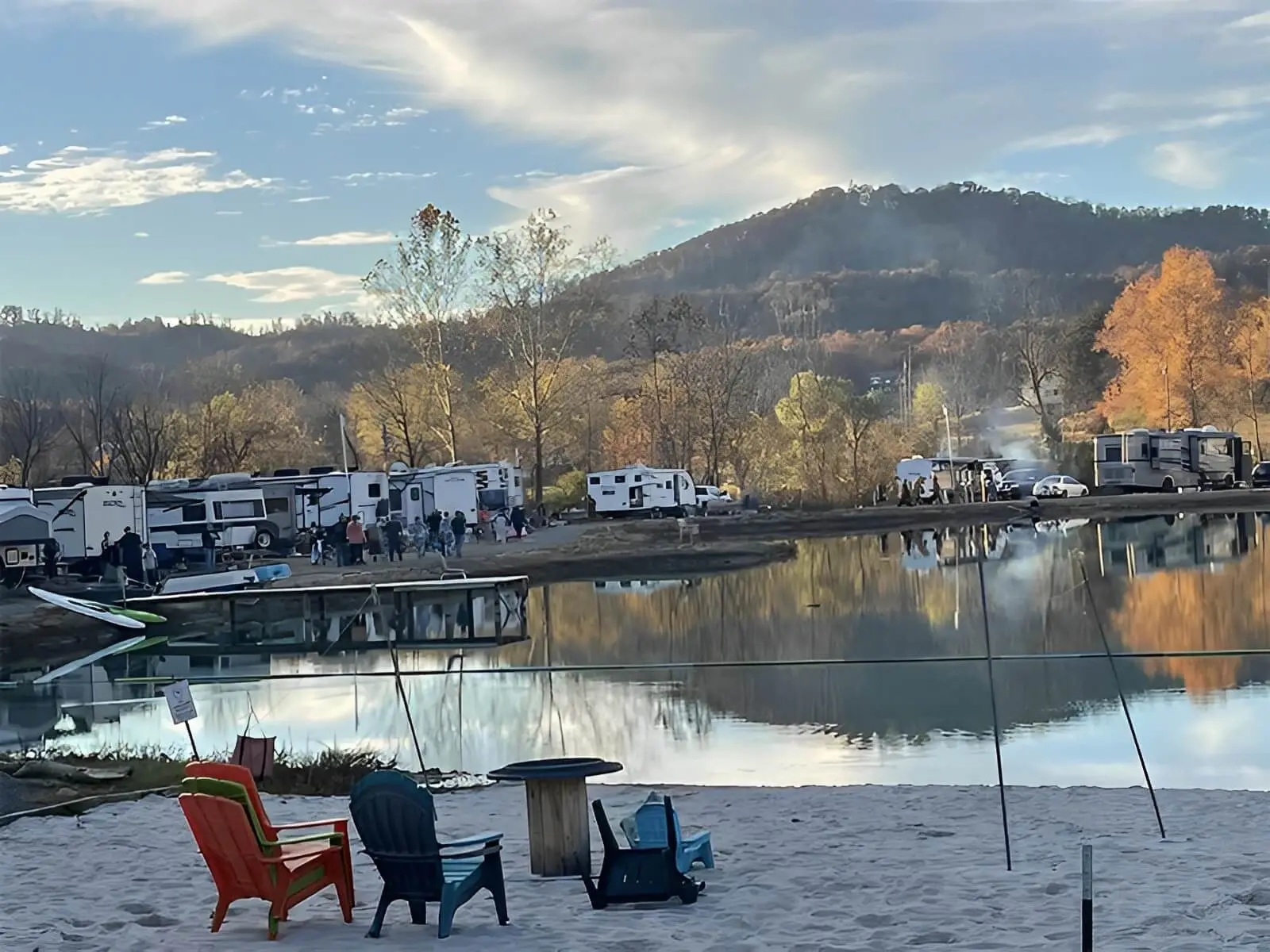 Guests gathered at the lake beach at Mammoth Ridge RV Park