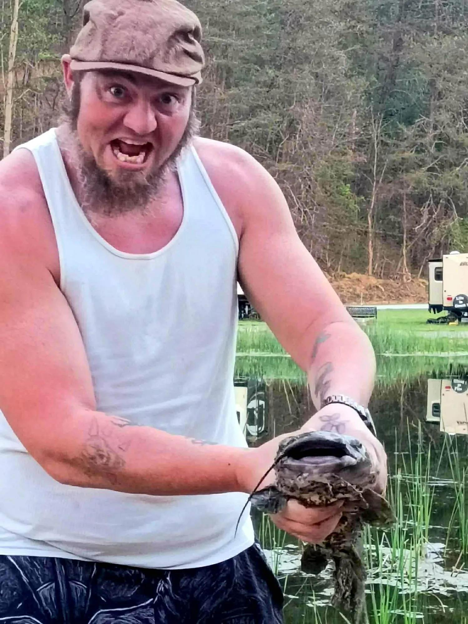 Guest proudly showing a catfish caught at the park