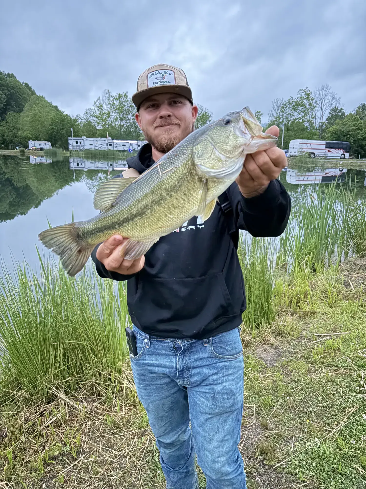 Guest holding a bass caught at Mammoth Ridge